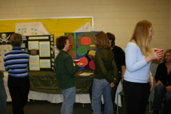 students in front of their posters